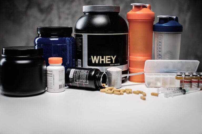 bottles of different supplements and vitamins on a table