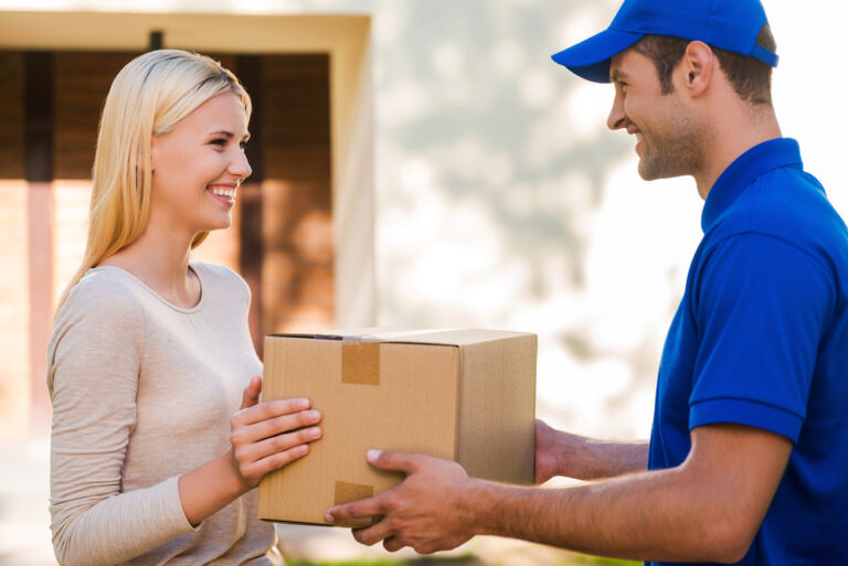 Delivery worker handing off package to a customer