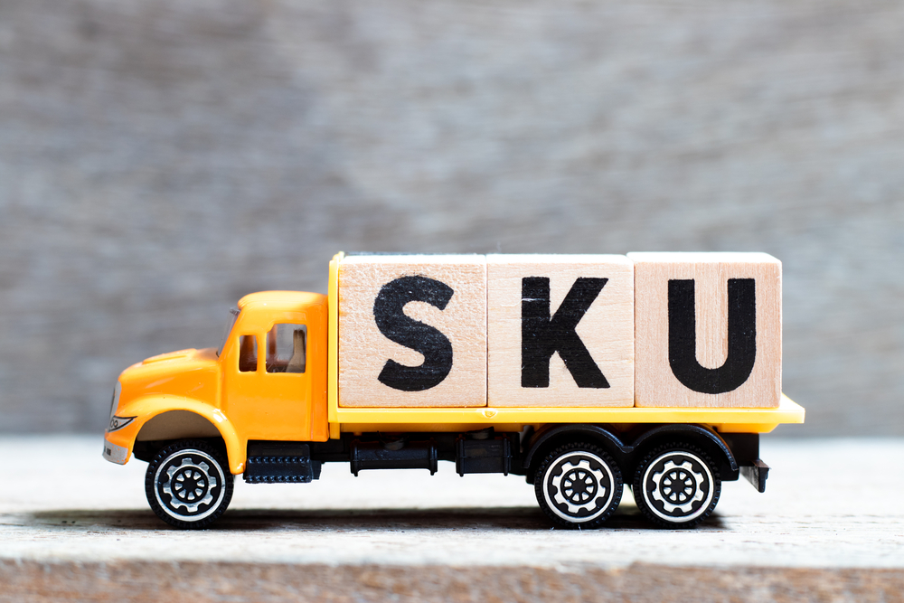 Truck hold ingletter blocks making up the abbreviation SKU