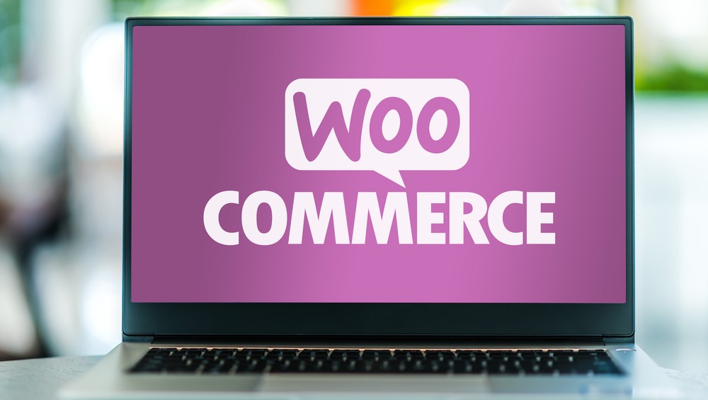 Laptop computer displaying logo of WooCommerce