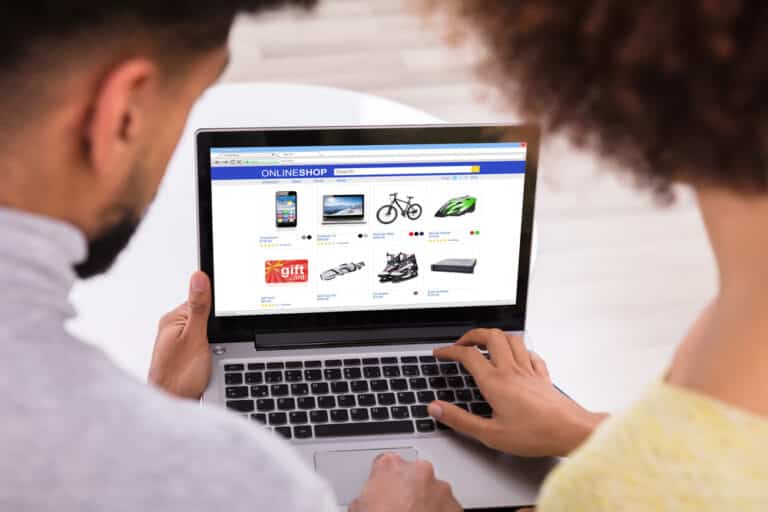 Couple Using Laptop For Shopping Online