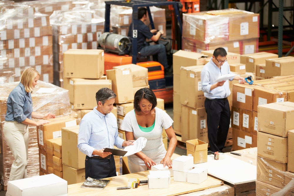 Warehouse workers preparing orders for shipping.